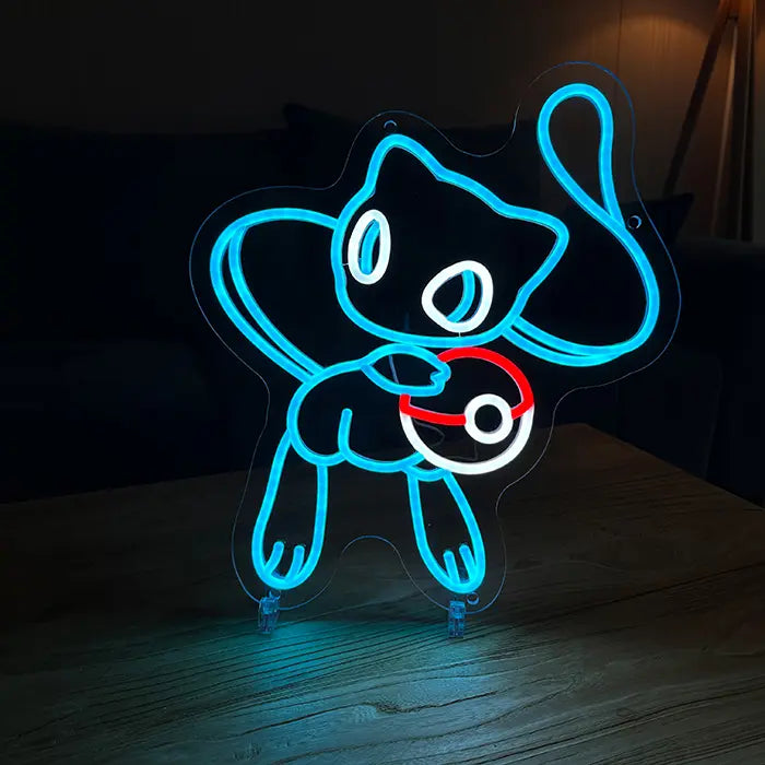 Pokémon Mew Neon LED Sign in blue standing on a wooden table, a sofa behind it in the darkened room