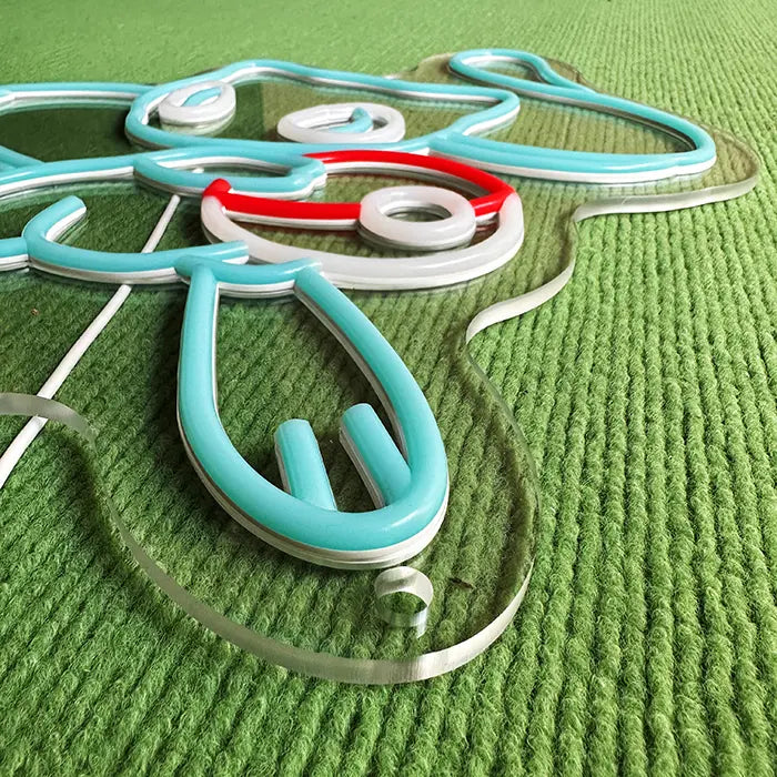 Pokémon Mew Neon LED Sign switched off at an angle from above, the neon tube standing out on the acrylic
