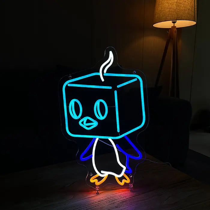 Pokémon Eiscue Neon LED Sign standing on a wooden table with a warm floor lamp behind it