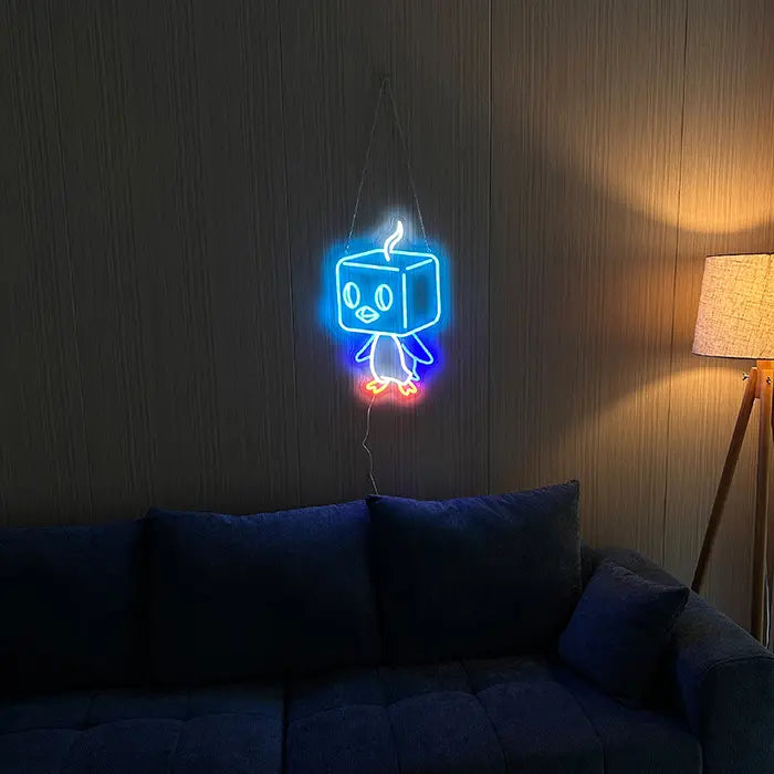 Pokémon Eiscue Neon LED Sign on a dark wall above a sofa, a floor lamp beside it
