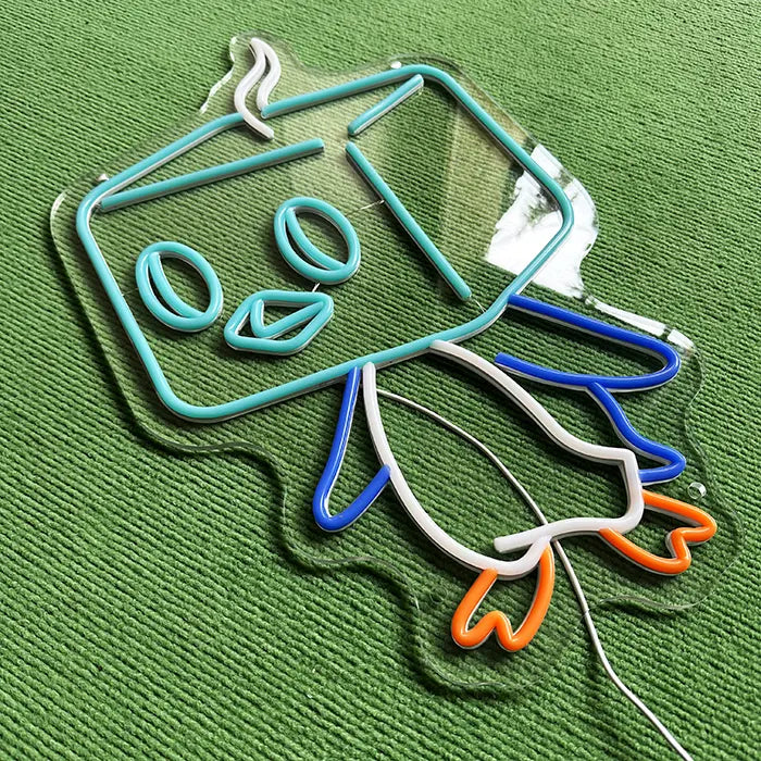 Pokémon Eiscue Neon LED Sign switched off at an angle from above, neon tubing standing out on the acrylic