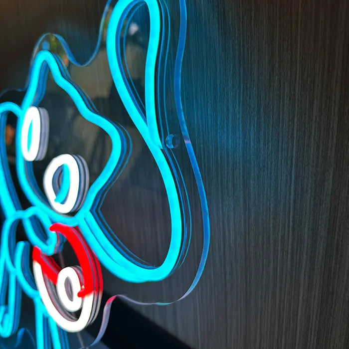 Pokémon Mew Neon LED Sign in blue in a macro shot, face and red-and-white ball filling the frame