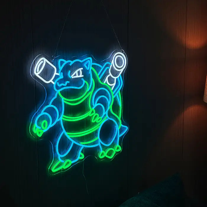 Pokémon Blastoise Neon LED Sign, Space Edition, hung from ropes on a dark wall with a lamp beside it