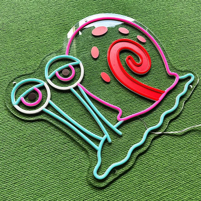 Gary the Snail Neon LED Sign switched off at an angle from above, neon tubing standing out on the acrylic