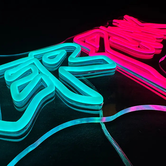 CYBERPUNK Neon LED Sign in macro, turquoise and pink neon tubes close beside one another