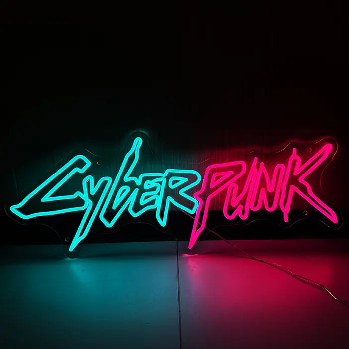 CYBERPUNK Neon LED Sign glowing head-on, lettering in turquoise and pink against a dark background