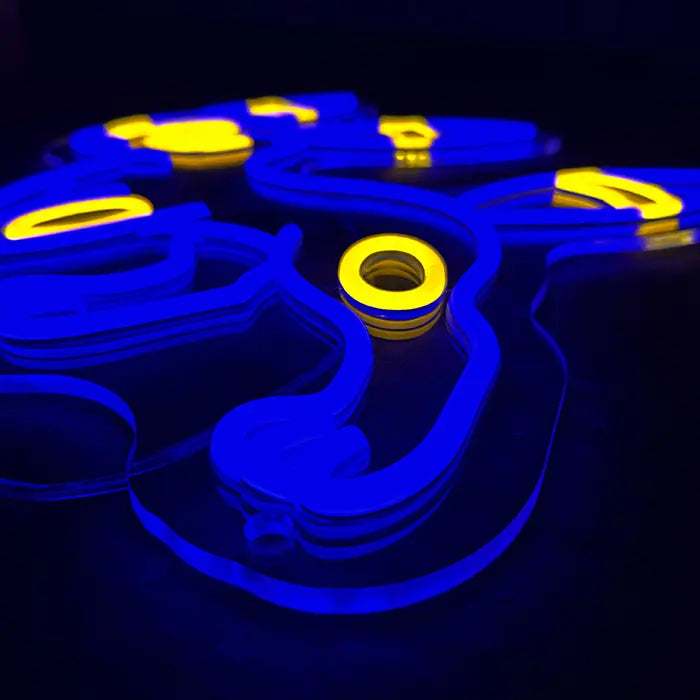 Pokémon Umbreon Neon LED Sign photographed at an angle from below, a blue contour with yellow rings