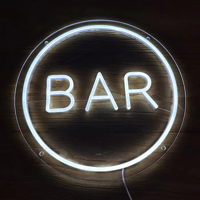BAR Neon LED Sign head-on against a dark wooden wall, white glowing lettering inside the closed neon circle