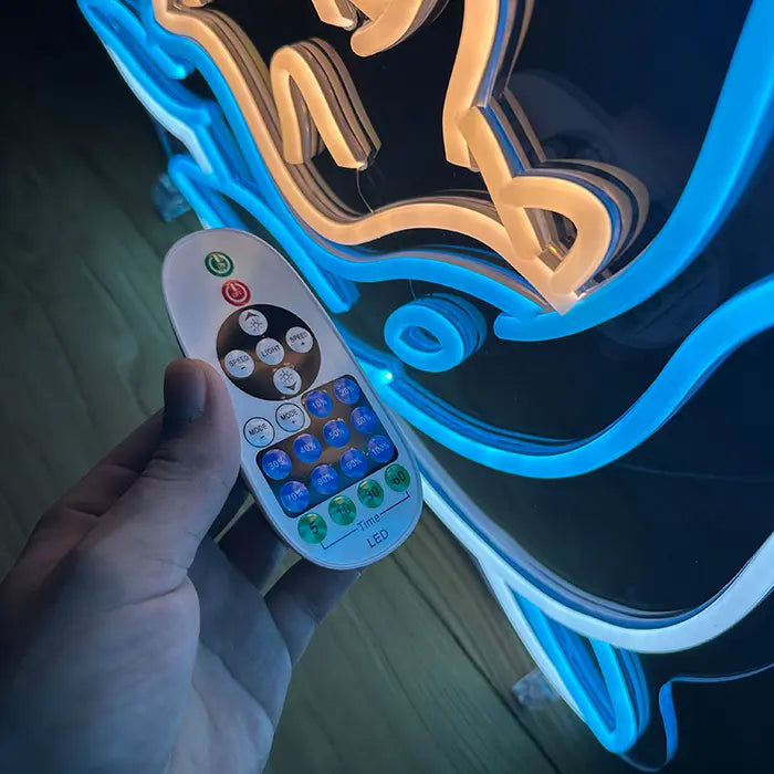 Mythical Pokémon Set Neon LED Sign, motif Lapras: in close-up with the remote control in hand in front of the neon lines