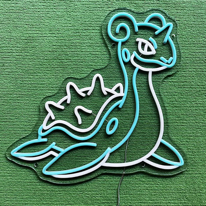Pokémon Lapras Neon LED Sign switched off on a green surface, full outline visible