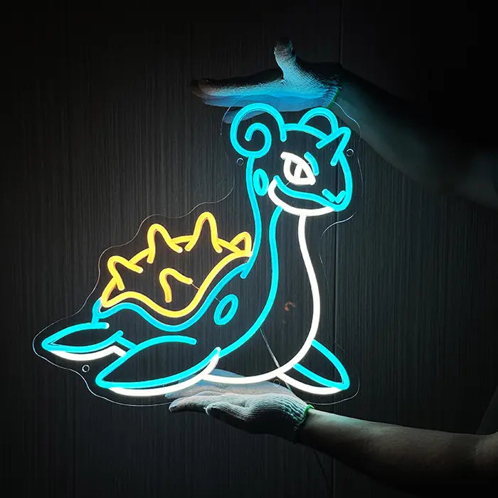 Pokémon Lapras Neon LED Sign being held against a dark wooden wall with gloves