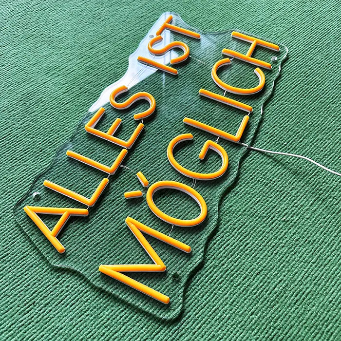 Anything Is Possible Neon LED Sign switched off from above at an angle, neon tubes on the acrylic panel
