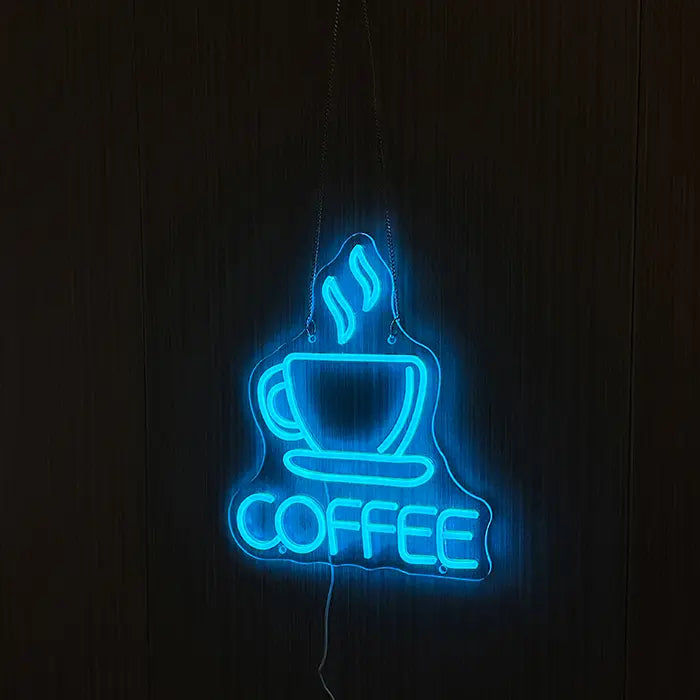 Coffee Cup Neon LED Sign on a dark wooden wall, steaming cup and lettering glowing blue