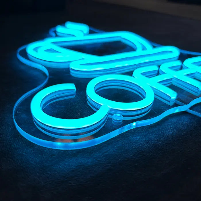 Coffee Cup Neon LED Sign in macro shot, ice-blue neon tubes on the acrylic panel