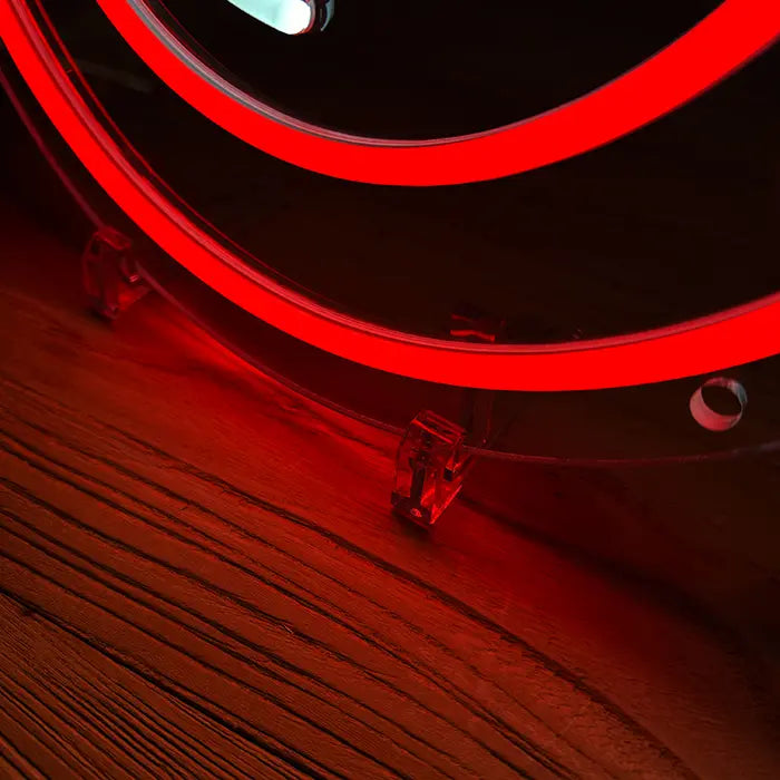 Ghostbusters Logo Neon LED Sign in detail, red circle and stand on a wooden surface