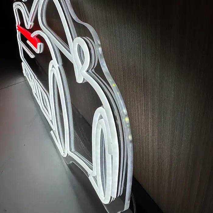 GT Sports Car Neon LED Sign photographed from the side on the wall, the acrylic edge follows the outline