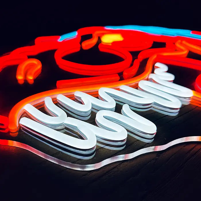 T-Rex Dino Neon LED Sign in close-up at an angle, white row of teeth raised on clear acrylic