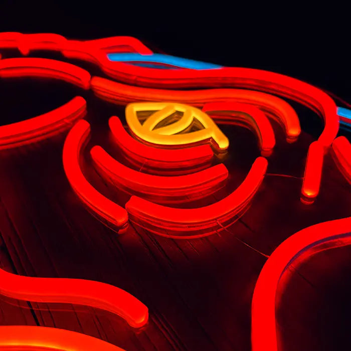 T-Rex Dino Neon LED Sign in macro shot, yellow eye between red neon lines