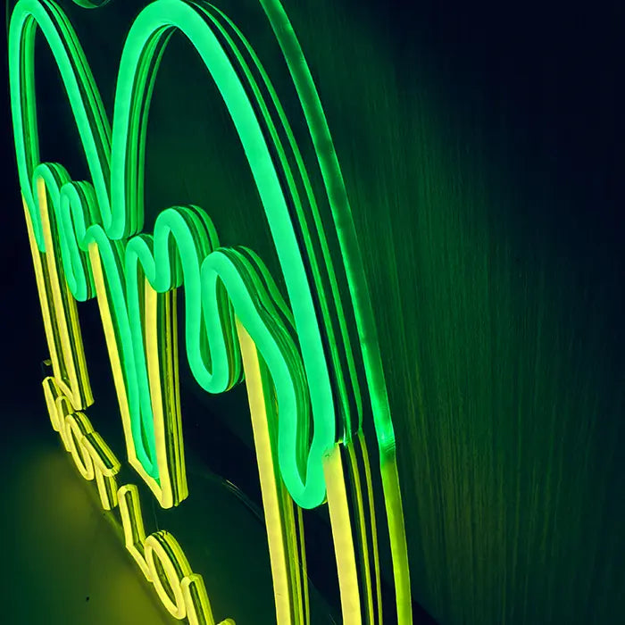 McDonald's Not Lovin' It Neon LED Sign photographed from the side, green drips and yellow M up close