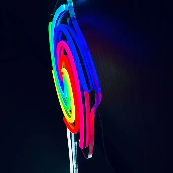 Lollipop Neon LED Sign photographed from the side, the neon tubes stand out from the panel