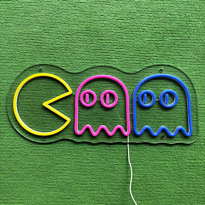 Retro Ghosts Neon LED Sign switched off on a green surface, full outline visible