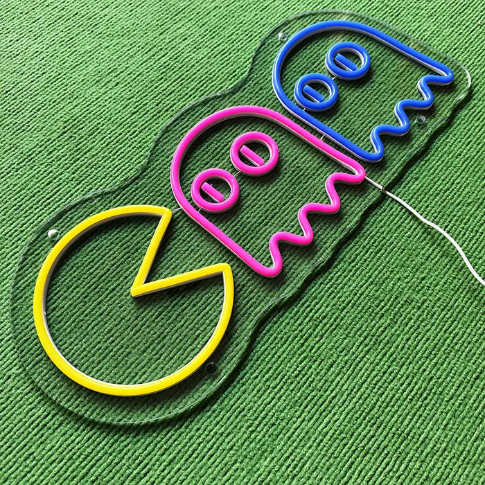 Retro Ghosts Neon LED Sign switched off from above at an angle, neon tubes on the acrylic panel
