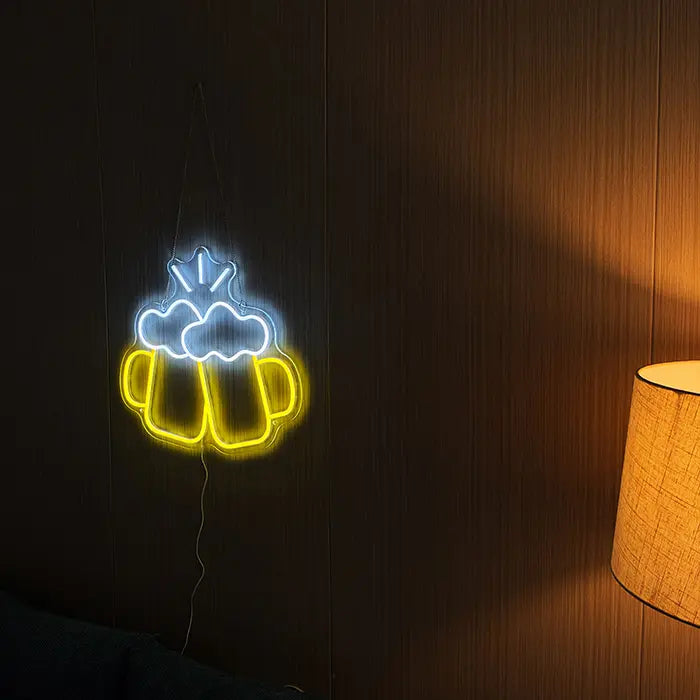 Beer Steins Neon LED Sign on a dark wooden wall next to a table lamp, yellow and white glowing