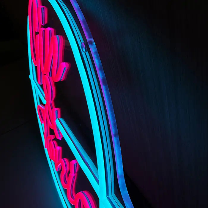 Gin & Tonic Neon LED Sign from the side on the wall, turquoise circle and pink letters up close