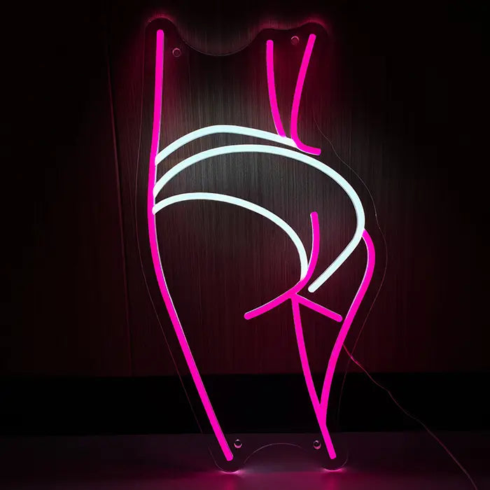 Sexy Boogie Neon LED Sign front view against a dark wooden wall, body silhouette in pink with white briefs