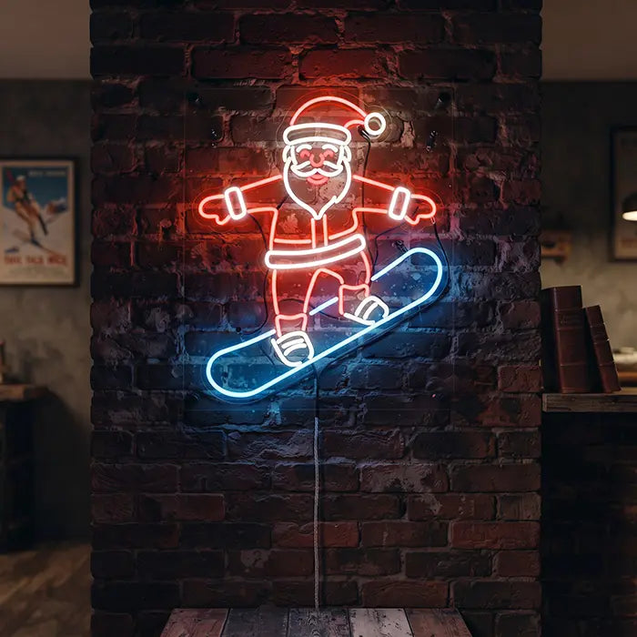 Snowboarding Santa Neon LED Sign on a brick wall with the cable running down, glowing red and blue