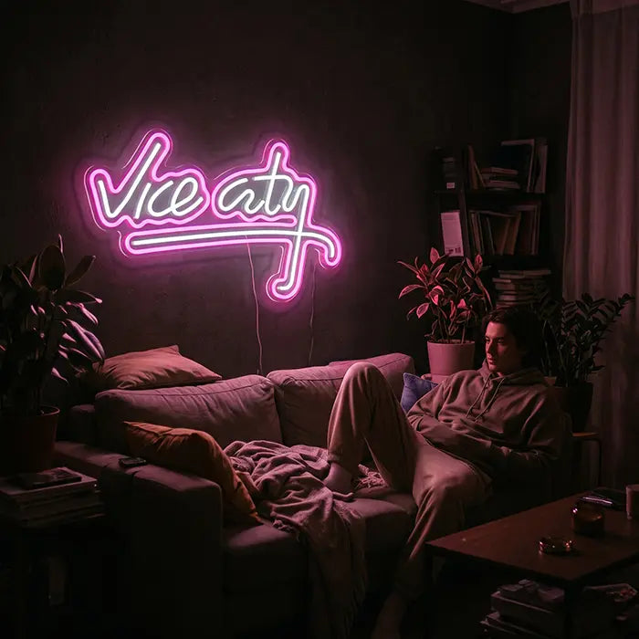 Vice City Original Neon LED Sign on a wall above a man on the sofa