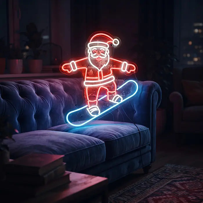Snowboarding Santa Neon LED Sign above a blue Chesterfield sofa in a dark living room