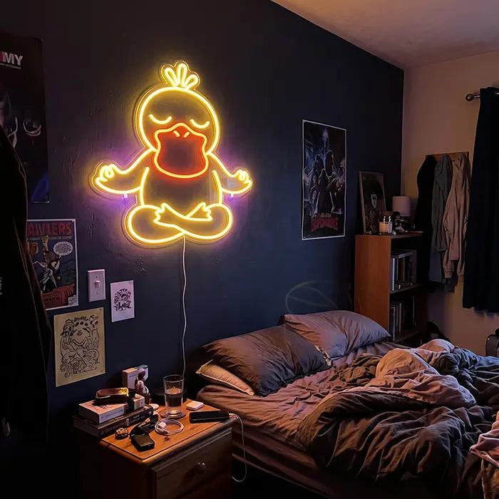Pokémon Psyduck in Meditation Set Neon LED Sign, design Good Vibes Psyduck: on a dark blue bedroom wall above the bed and bedside table