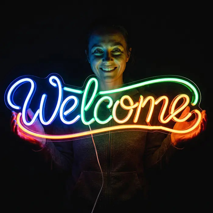 Welcome Neon LED Sign held by a smiling woman