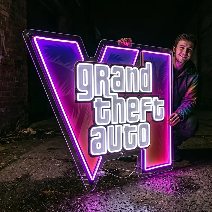 GTA VI Logo Neon LED Sign with UV print in XXXL format, held by a smiling man on wet asphalt
