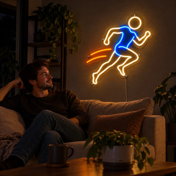 Evening Runner Neon LED Sign on a living room wall, a person relaxing on the sofa in front of it