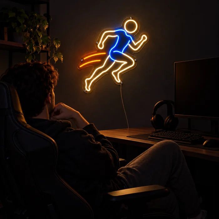 Evening Runner Neon LED Sign above a gaming desk, a gamer in a gaming chair in front of it