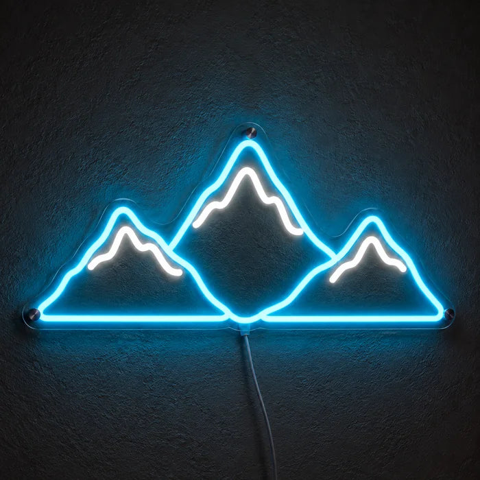 Mountain Silhouette Neon LED Sign glowing on a dark wall, close-up with connection cable