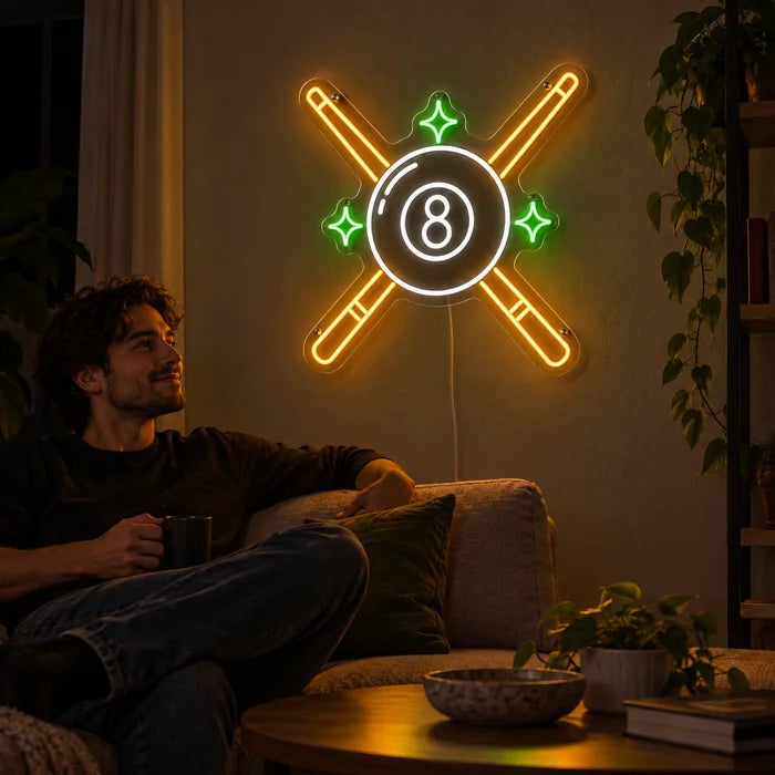 Crossed Pool Cues Neon LED Sign on a living room wall, a person relaxing on the sofa in front of it