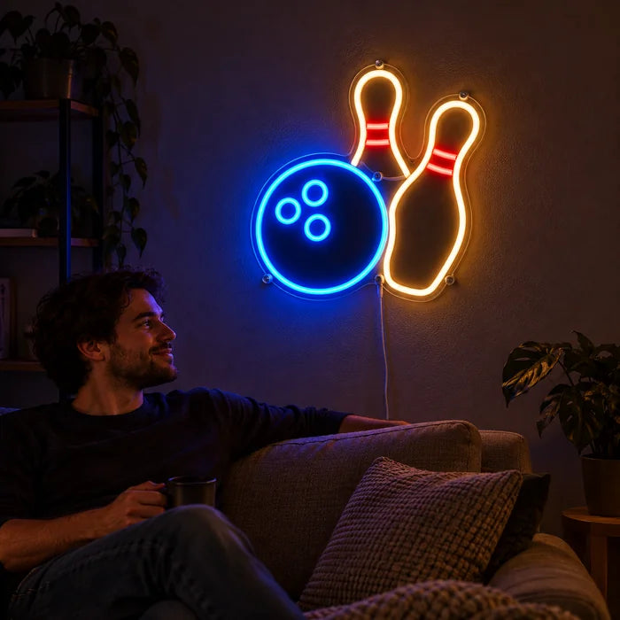Bowling Night Neon LED Sign on a living room wall, a person relaxing on the sofa in front of it