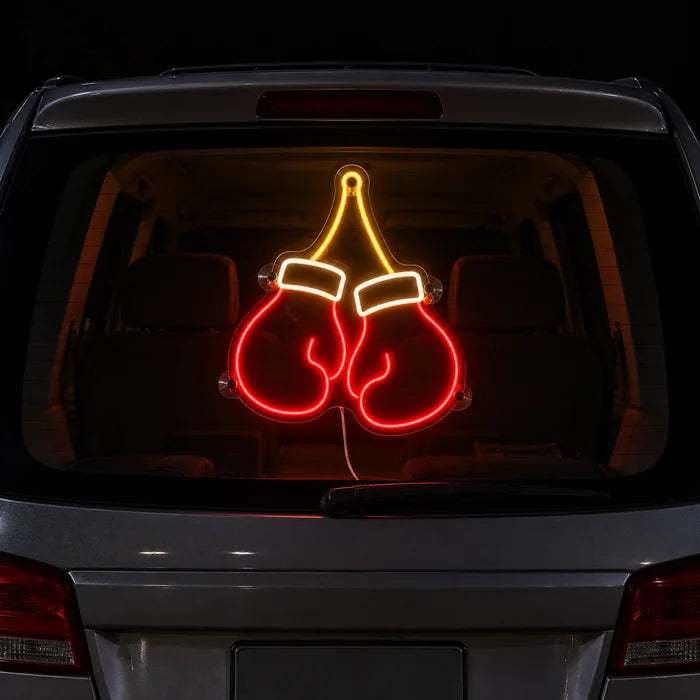 Boxing Gloves Neon LED Sign on the rear window of a car at night