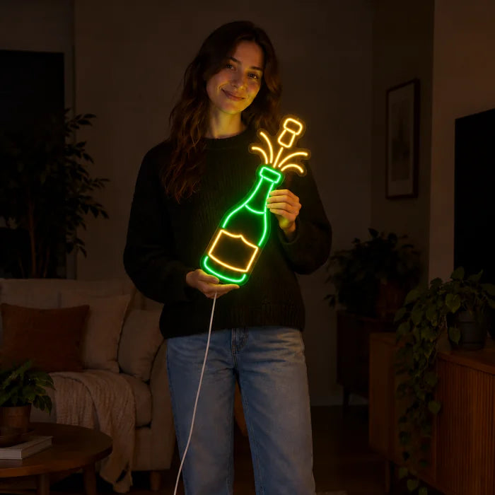 Champagne Neon LED Sign held by a woman, showing its size compared to her body
