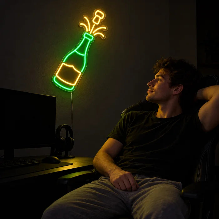 Champagne Neon LED Sign above a gaming desk, a gamer in a gaming chair in front of it