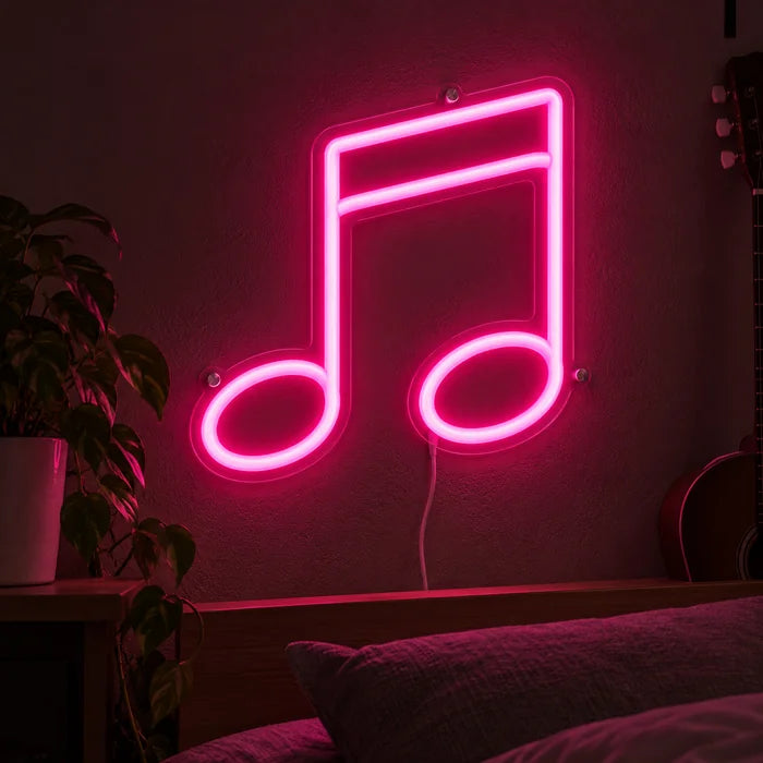 Neon LED-skylt Dubbelnot lyser på en mörk vägg, närbild med anslutningskabel