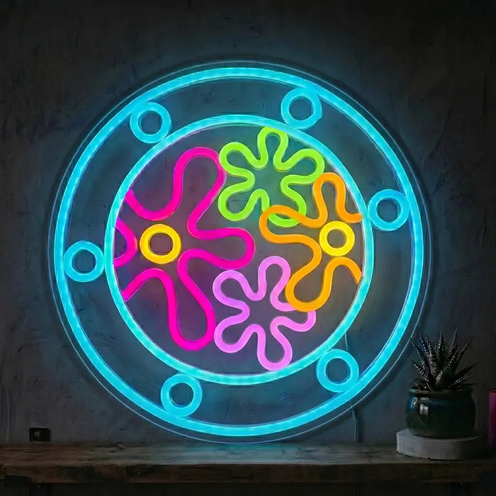 Neon LED-skilt Blomsterskyer: en rund dobbeltring med seks naglede sirkler og bak den fire blomsterformede skyer i neonfarger