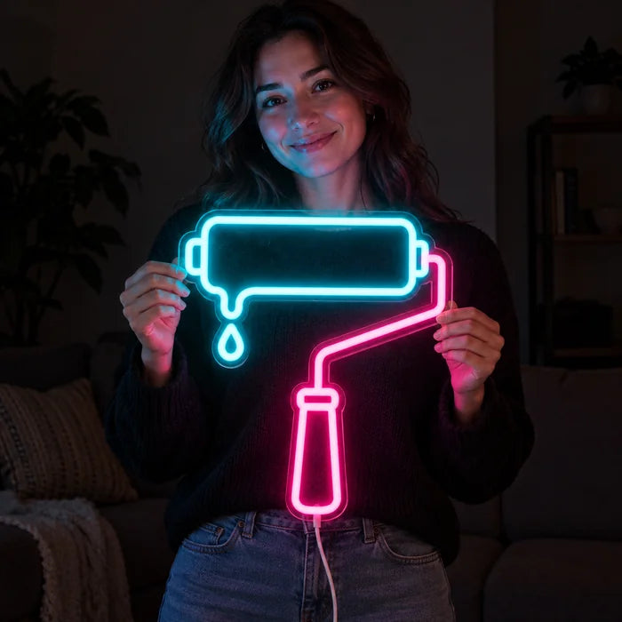 Paint Roller Neon LED Sign held by a smiling woman against a dark background