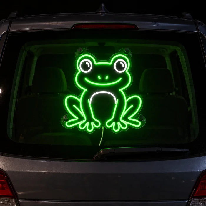 Frog Friend Neon LED Sign on the rear window of a car at night
