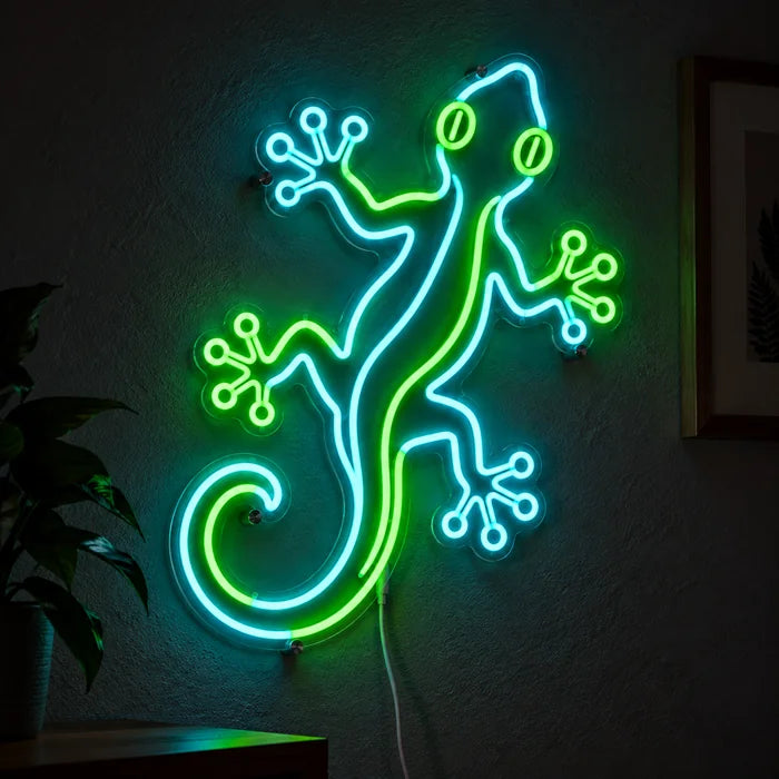 Green Gecko Neon LED Sign glowing on a dark wall, close-up with connection cable