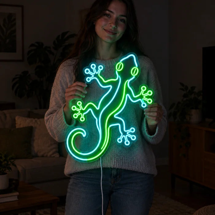 Green Gecko Neon LED Sign held by a woman, showing its size compared to her body
