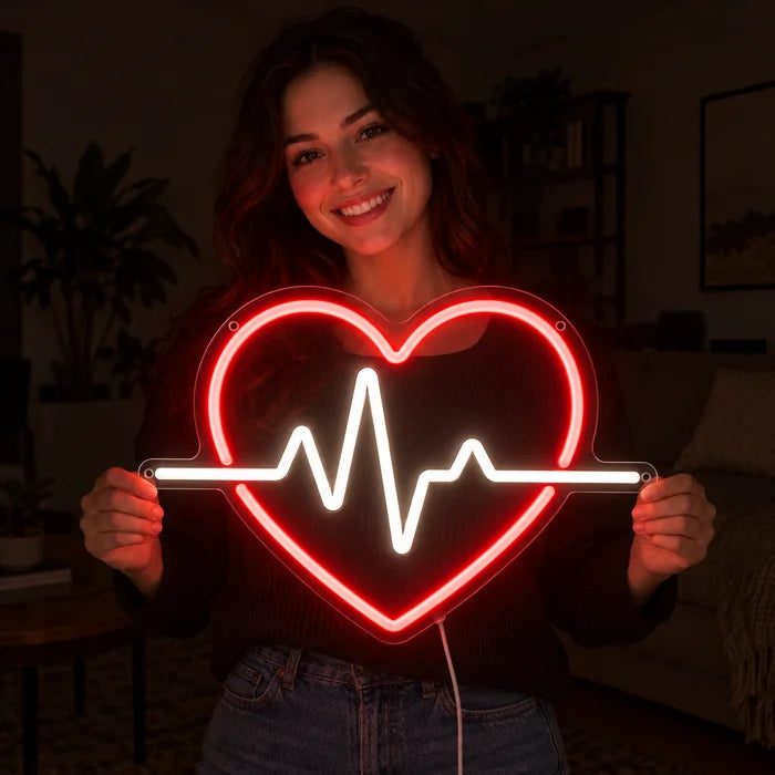 Heartbeat Neon LED Sign held by a smiling woman against a dark background